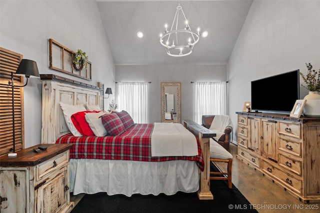 carpeted bedroom featuring high vaulted ceiling and an inviting chandelier