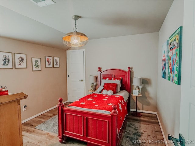 bedroom featuring hardwood / wood-style flooring