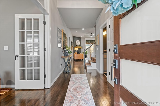 entryway featuring dark hardwood / wood-style floors, ceiling fan, and french doors