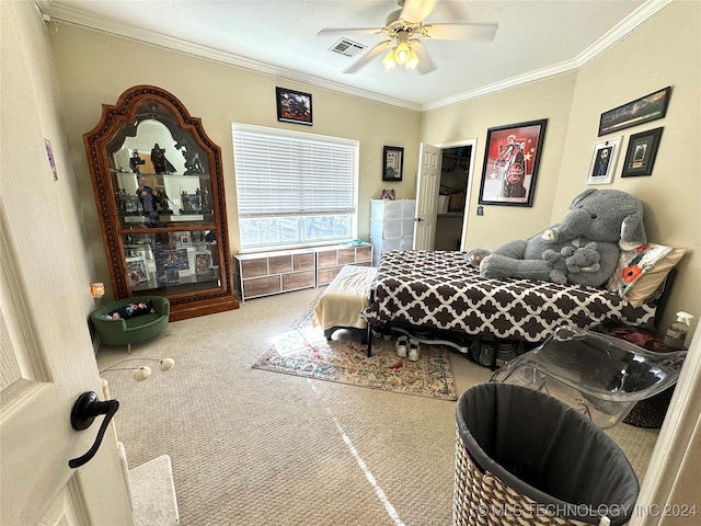 carpeted bedroom featuring ceiling fan, visible vents, and ornamental molding