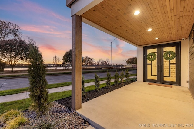 patio terrace at dusk with french doors