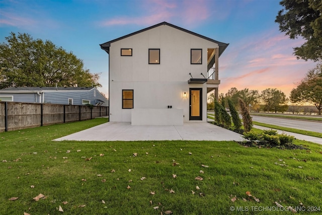 203 E 45th Ct, Tulsa, OK 74105 - back of property featuring a patio and stucco siding