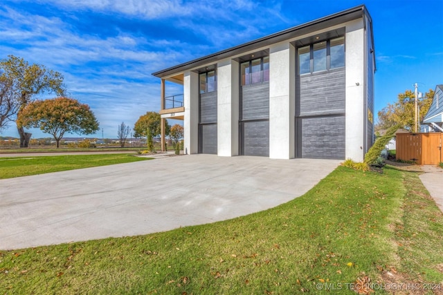 garage featuring a yard