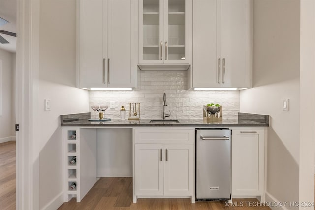 203 E 45th Ct, Tulsa, OK 74105 - kitchen featuring tasteful backsplash and white cabinets
