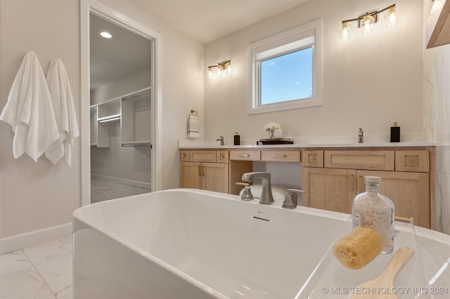 203 E 45th Ct, Tulsa, OK 74105 - full bathroom with marble look tile flooring, a soaking tub, recessed lighting, and double vanity