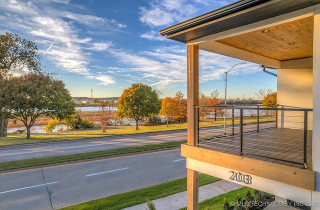 wooden terrace with a water view