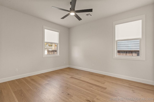 unfurnished room with ceiling fan and light hardwood / wood-style floors