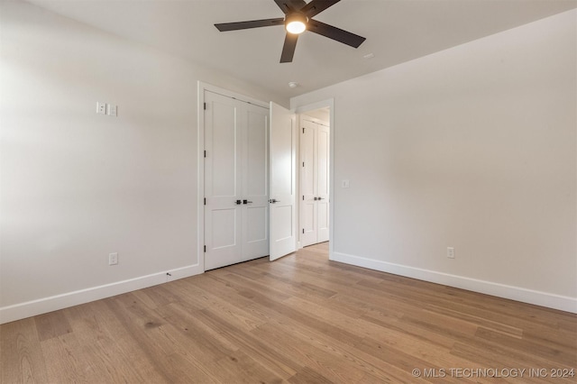 unfurnished room featuring light hardwood / wood-style flooring and ceiling fan