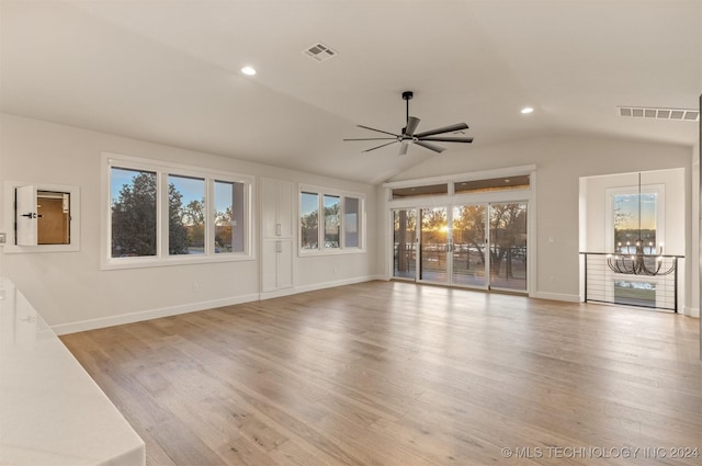 203 E 45th Ct, Tulsa, OK 74105 - unfurnished living room with ceiling fan, recessed lighting, vaulted ceiling, a chandelier, and wood finished floors