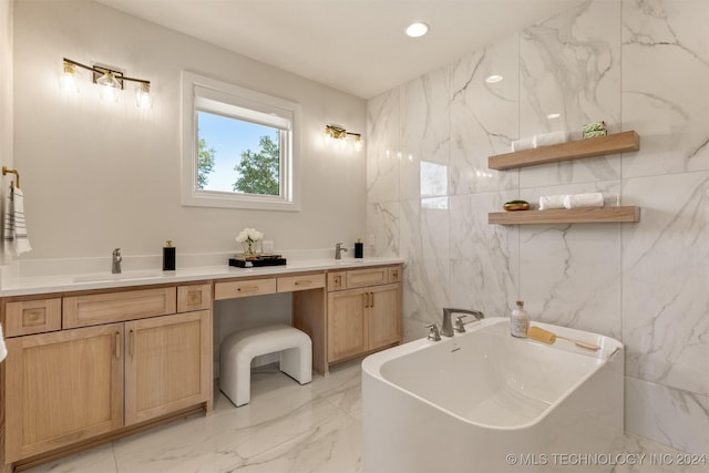 bathroom with a washtub, tile walls, and vanity