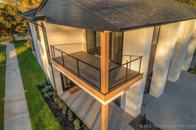 view of property exterior with a balcony