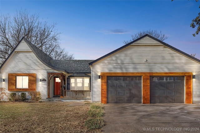 ranch-style home featuring a garage