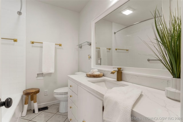 bathroom with tile patterned floors, vanity, and toilet