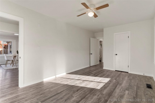 unfurnished room with ceiling fan and hardwood / wood-style floors