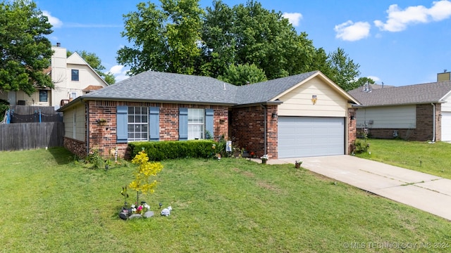 ranch-style home featuring a front lawn and a garage