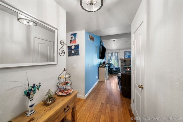 corridor featuring light hardwood / wood-style floors