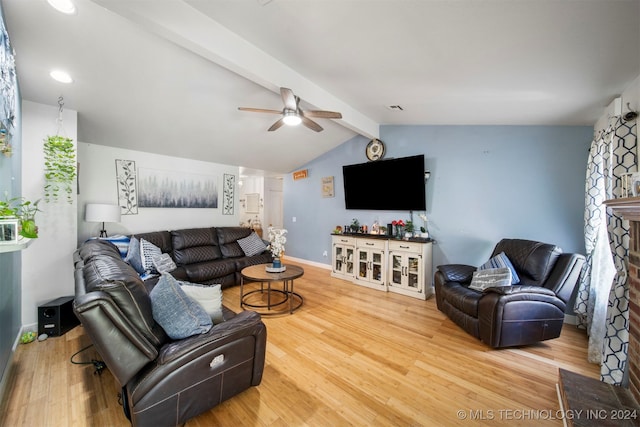 living room featuring hardwood / wood-style floors, vaulted ceiling with beams, and ceiling fan