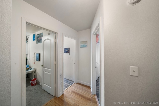 hall with light wood-type flooring