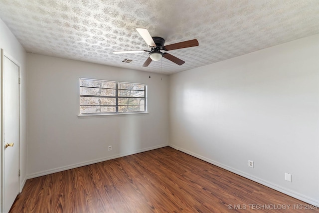 unfurnished room with a textured ceiling, hardwood / wood-style flooring, and ceiling fan