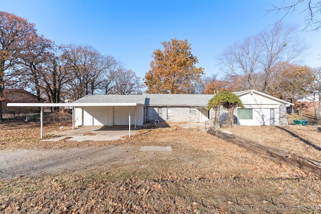 single story home with a carport