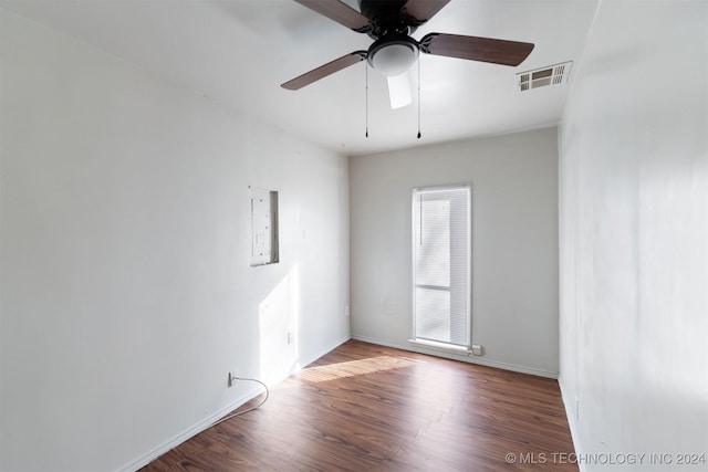 empty room featuring ceiling fan and hardwood / wood-style flooring