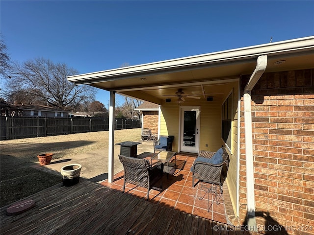 wooden deck featuring ceiling fan