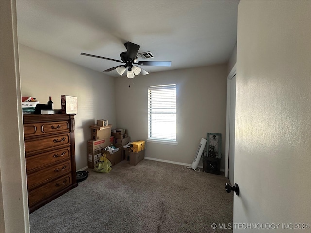 interior space featuring carpet floors and ceiling fan