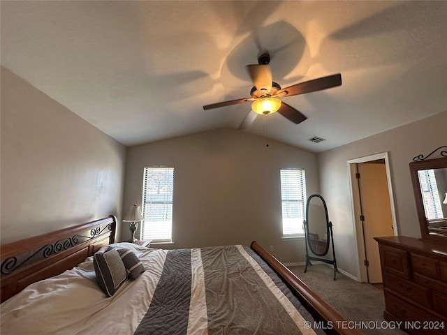 bedroom with lofted ceiling, carpet, multiple windows, and ceiling fan