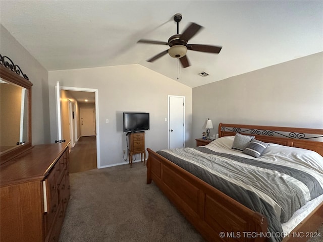 bedroom featuring ceiling fan, dark carpet, and vaulted ceiling