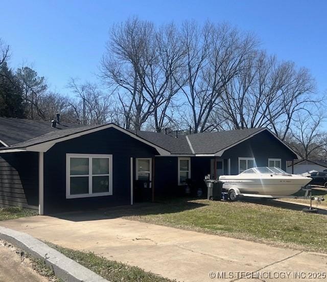 ranch-style house with a front yard