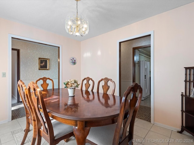 dining room featuring a chandelier and light tile patterned floors