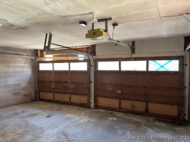 garage featuring a garage door opener