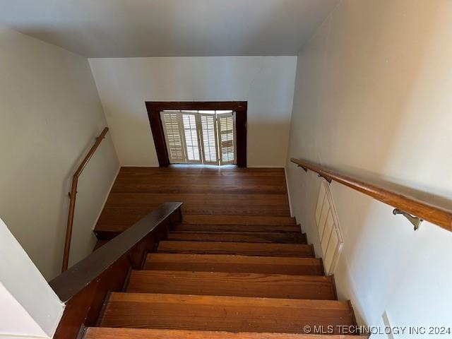 stairs with wood-type flooring