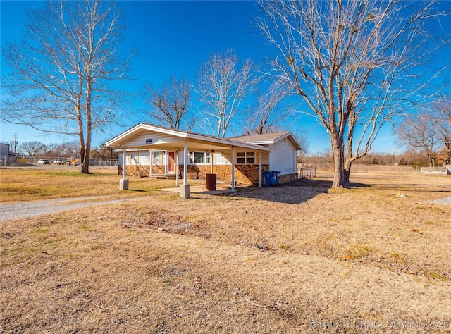 single story home with a front yard and a porch