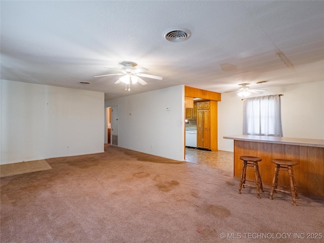 living room with light carpet and ceiling fan