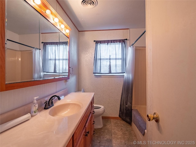 full bathroom featuring vanity, shower / bath combination with curtain, and toilet