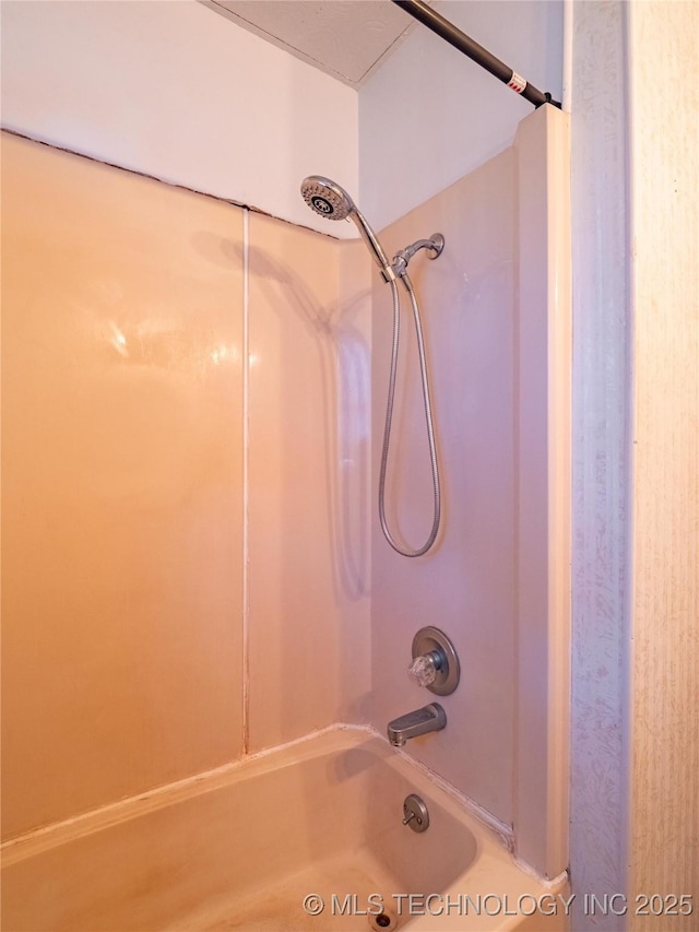 bathroom with shower / bath combination