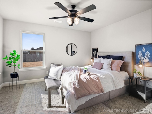 carpeted bedroom with ceiling fan