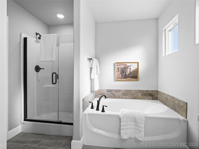 bathroom featuring plus walk in shower