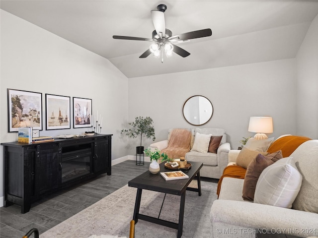 living room featuring ceiling fan and lofted ceiling