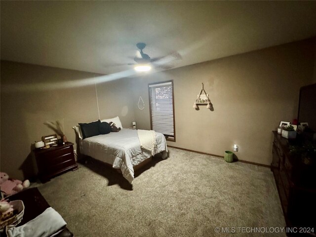 7750 River Ridge Rd, Muskogee, OK 74403 - bedroom with carpet and ceiling fan