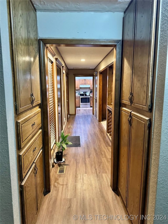 corridor featuring light hardwood / wood-style floors