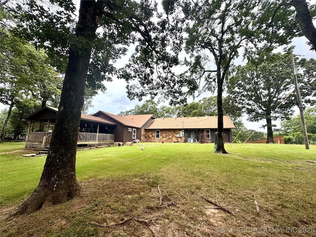 7750 River Ridge Rd, Muskogee, OK 74403 - back of property featuring a lawn