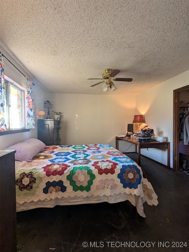 bedroom featuring carpet, a closet, ceiling fan, and a textured ceiling