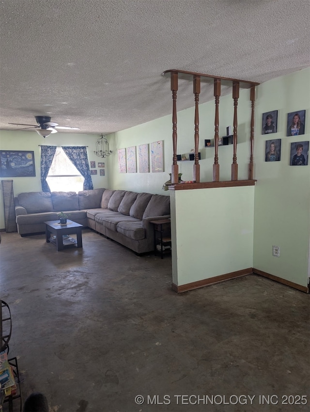 unfurnished living room with ceiling fan, concrete floors, baseboards, and a textured ceiling