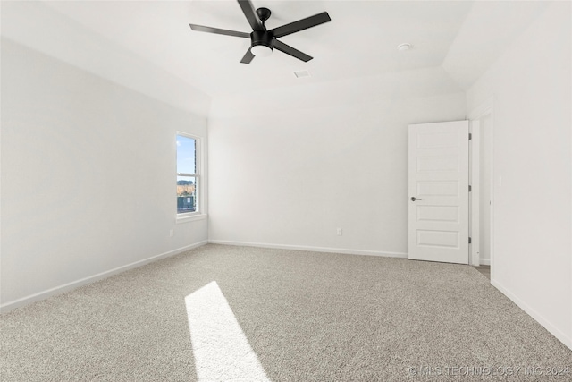 unfurnished room with ceiling fan, carpet, and vaulted ceiling