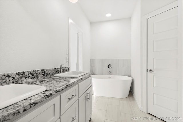 bathroom with a bathtub and vanity