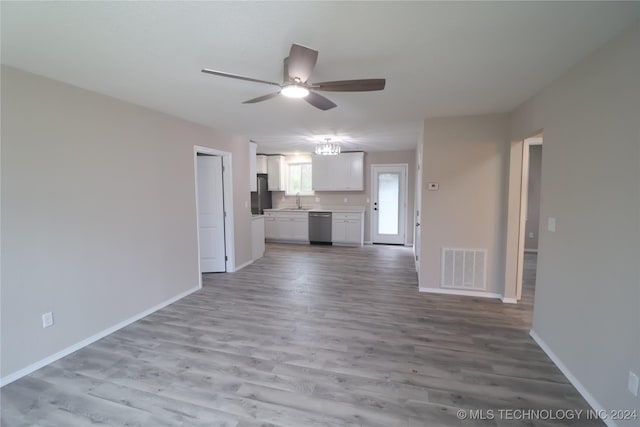 unfurnished living room with ceiling fan, sink, and light hardwood / wood-style floors