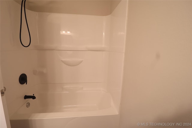 bathroom with shower / washtub combination