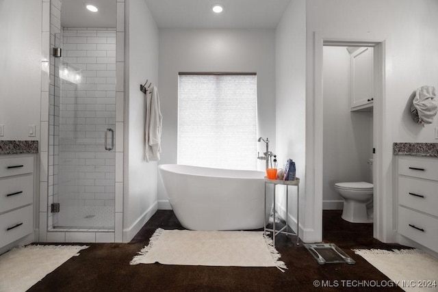 full bathroom with vanity, toilet, and shower with separate bathtub